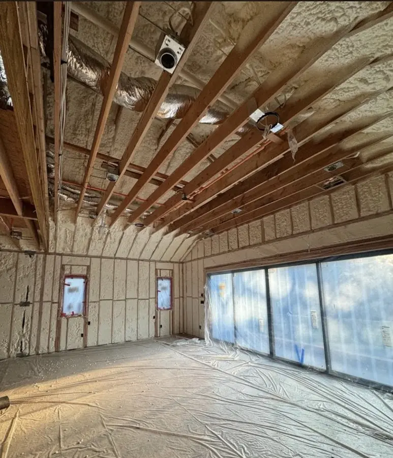 Interior walls and ceiling insulated with spray foam during new construction in Trenton